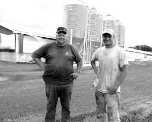 Adam and his father, Carl, Jr. stand in front of their new hog barn along Turner Camp Road Schellsburg.