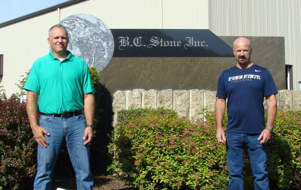 Rodney Bair, left, with Travis Collins in 2018 at BC Stone’s facility in the Everett Business Park.