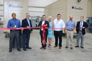 Mathu Solo, president of Tower Tech, center, celebrates the grand opening of the company's Pleasantville facility with a ribbon-cutting on Tuesday. Joining Solo were from left, john Makosky, director of operations; Shane Weyant, president and CEO of Creative Pultrusions; Perci Fungaroli, CFO; Micha Curtis, director of sales; Matt Wilson, project manager with Corle Building Systems; and Gregory Elliott, vice president of EADS Architects.